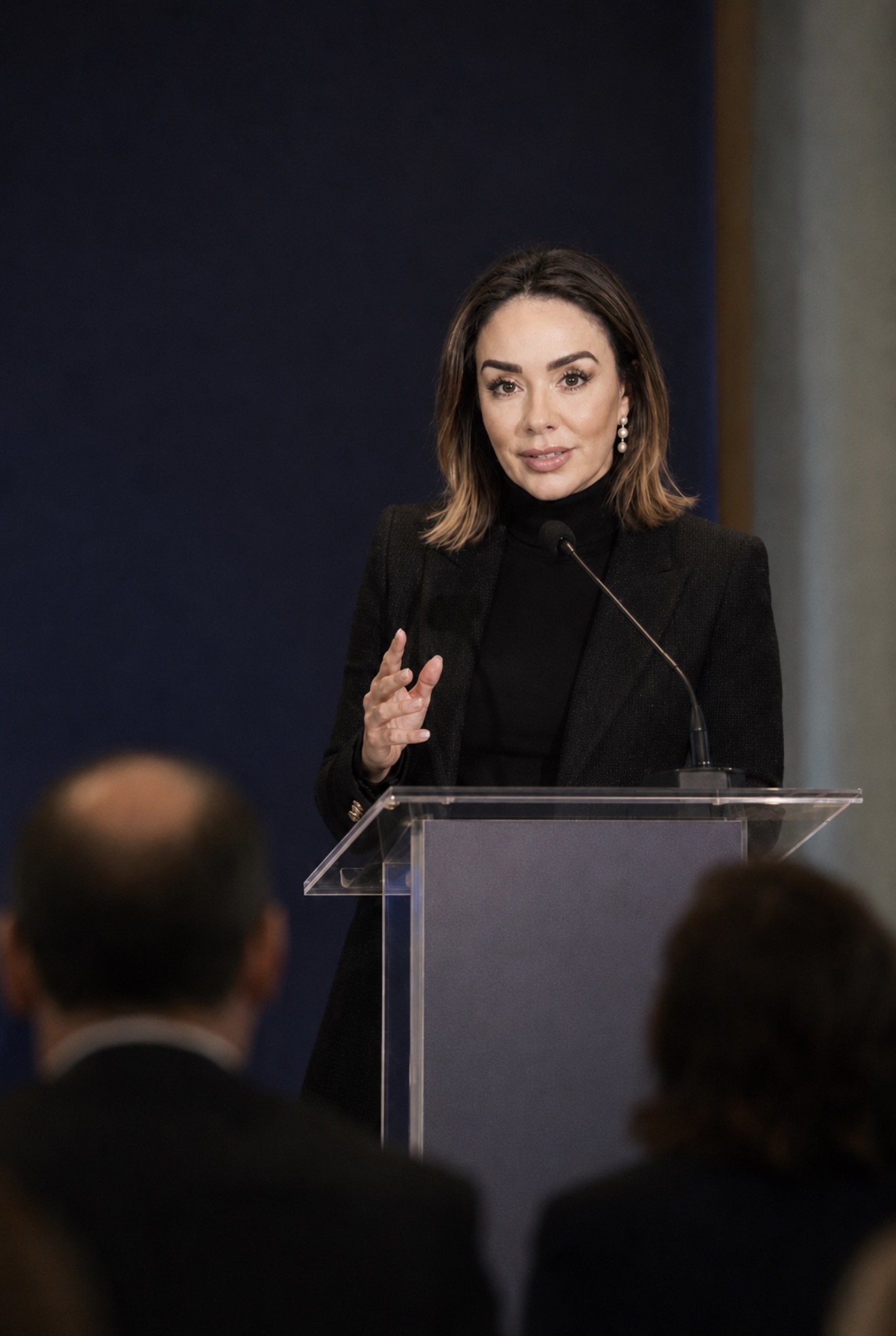 Dr. Nadja Giuffrida speaking at an institutional podium